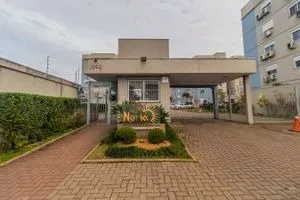 Alugo apartamento com vaga no estacionamento no condomínio Neriá Canoas Estância Velha