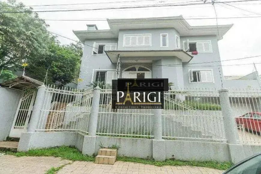 Casa com 5 dormitórios para alugar, 650 m² por R$ 8.449,00/mês - Santa Fé - Porto Alegre/R