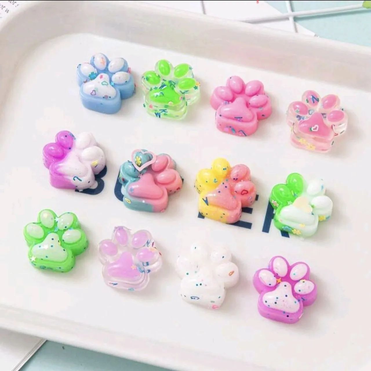 kit com 10 mini squishy patinhas de apertar 