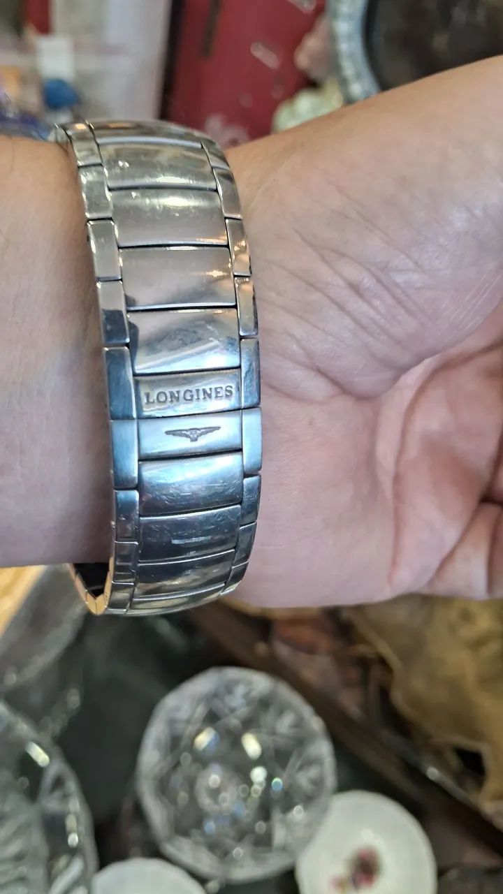 relógio é um Longines Oposition em aço inoxidável com mostrador branco. - Foto 5