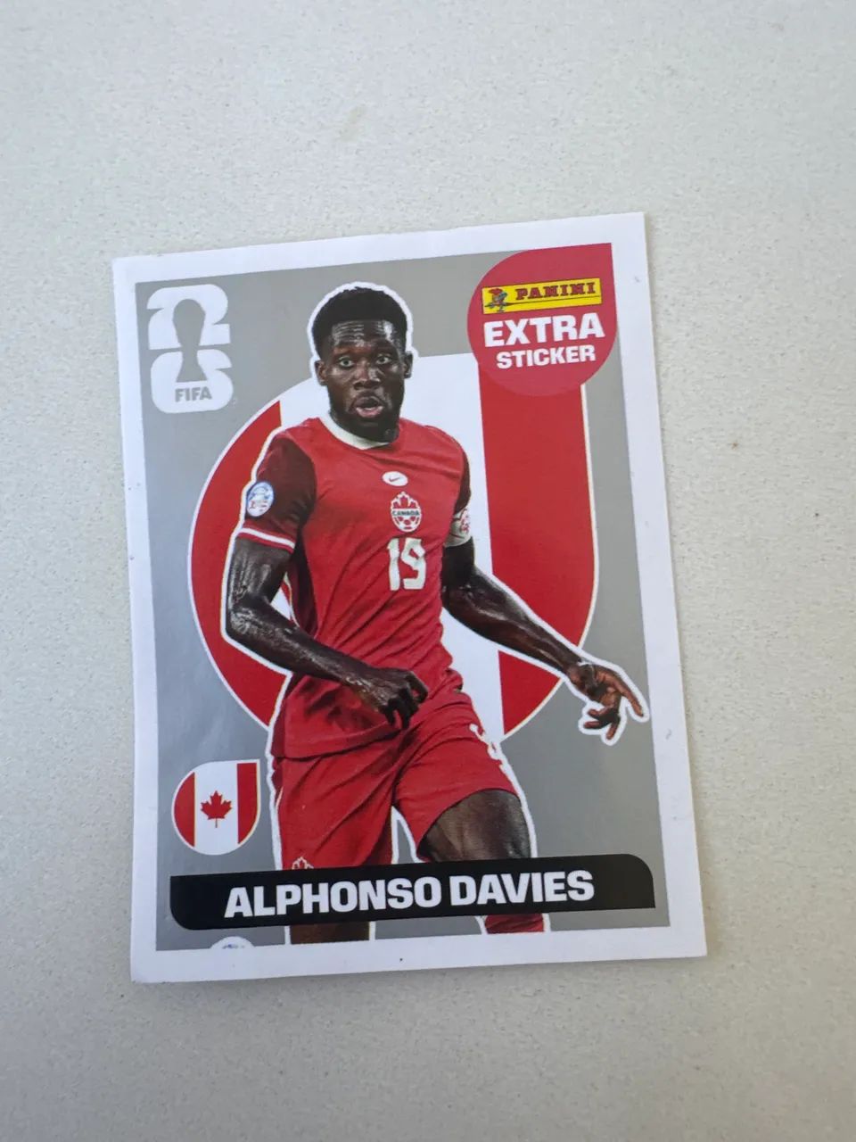 Figurinha Extra Sticker prata do ALPHONSO DAVIES do Canadá 