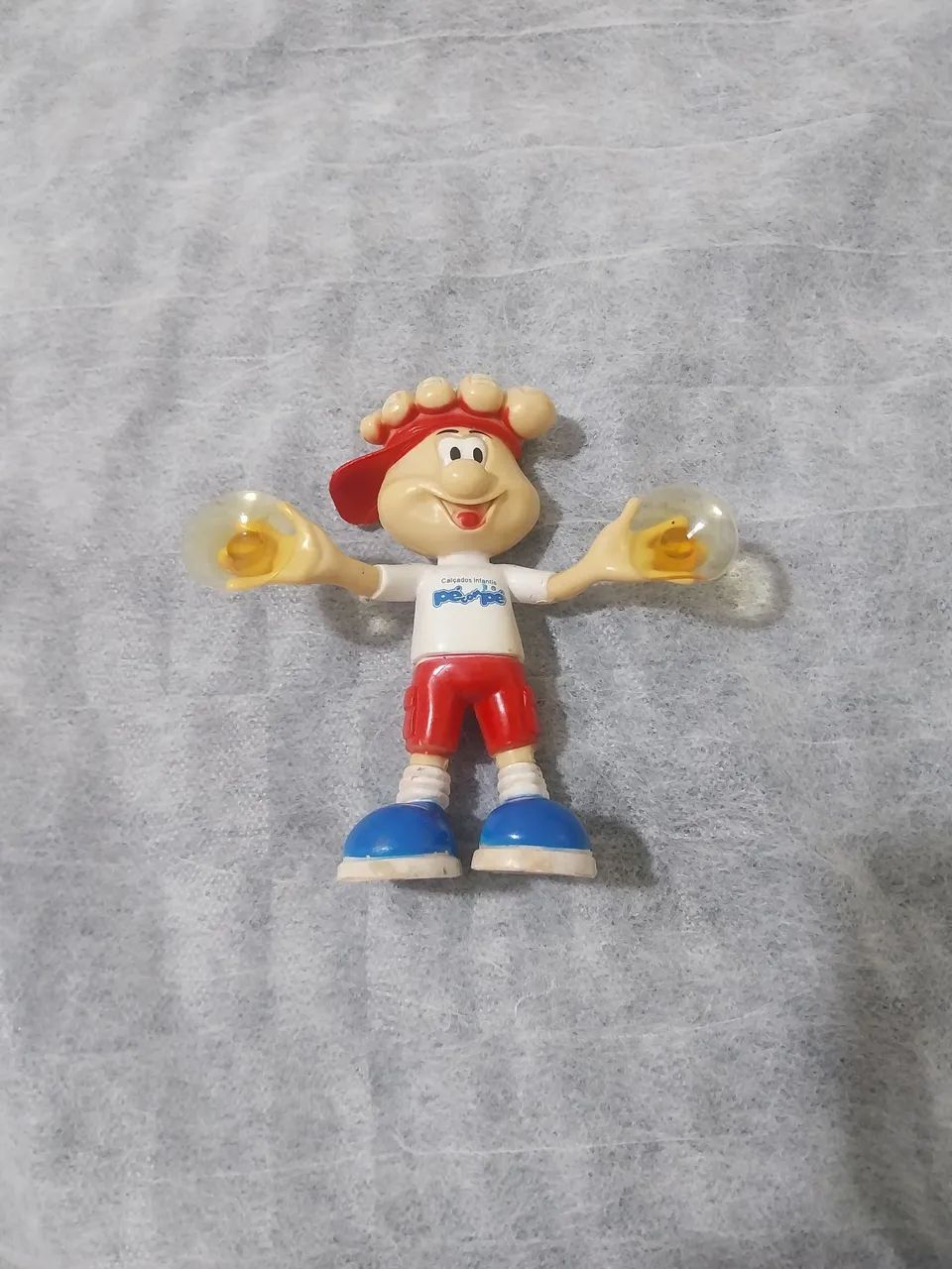 Boneco promocional calçados pé com pé 