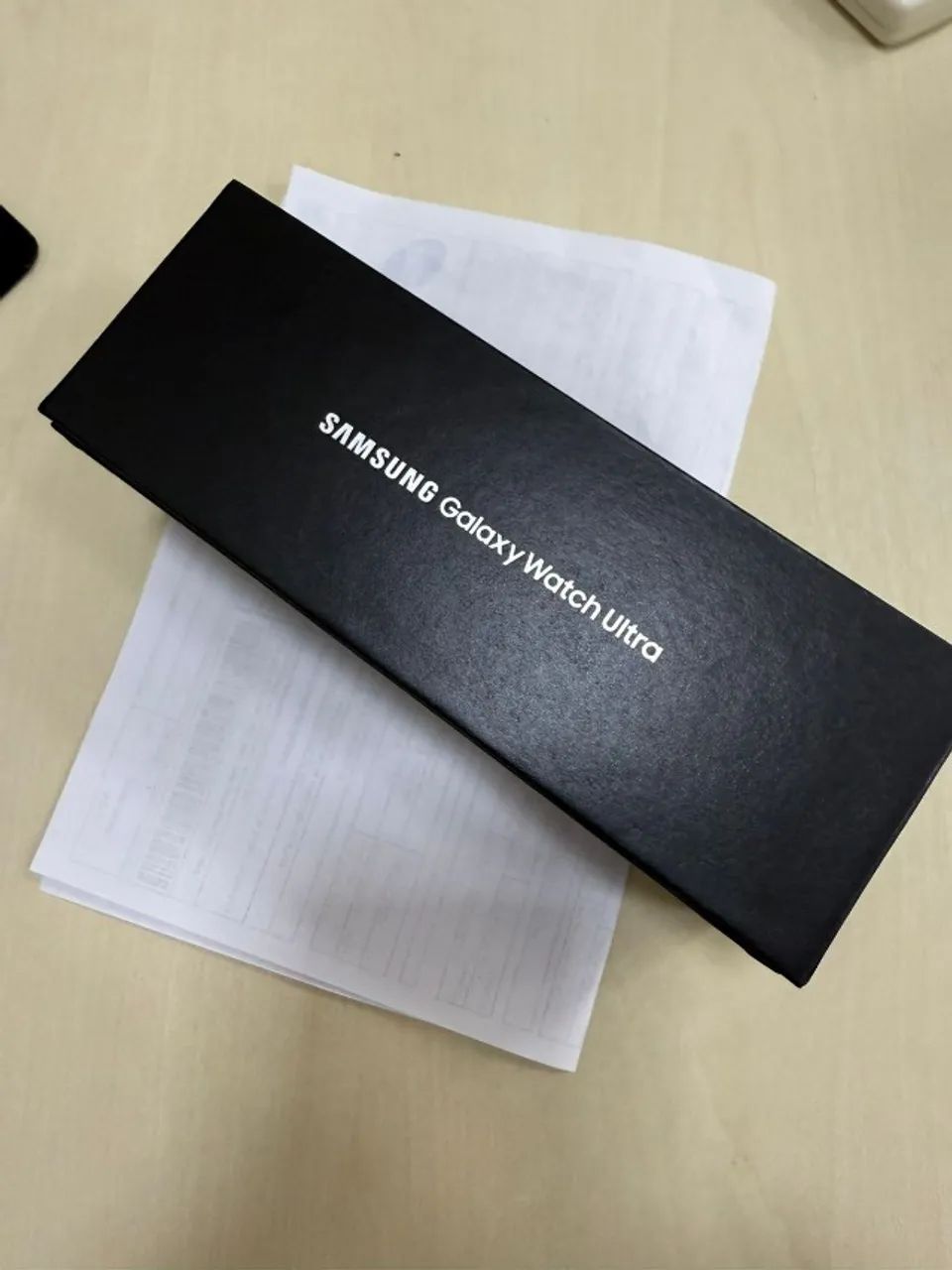 Samsung Galaxy Watch Ultra com nota e garantia.