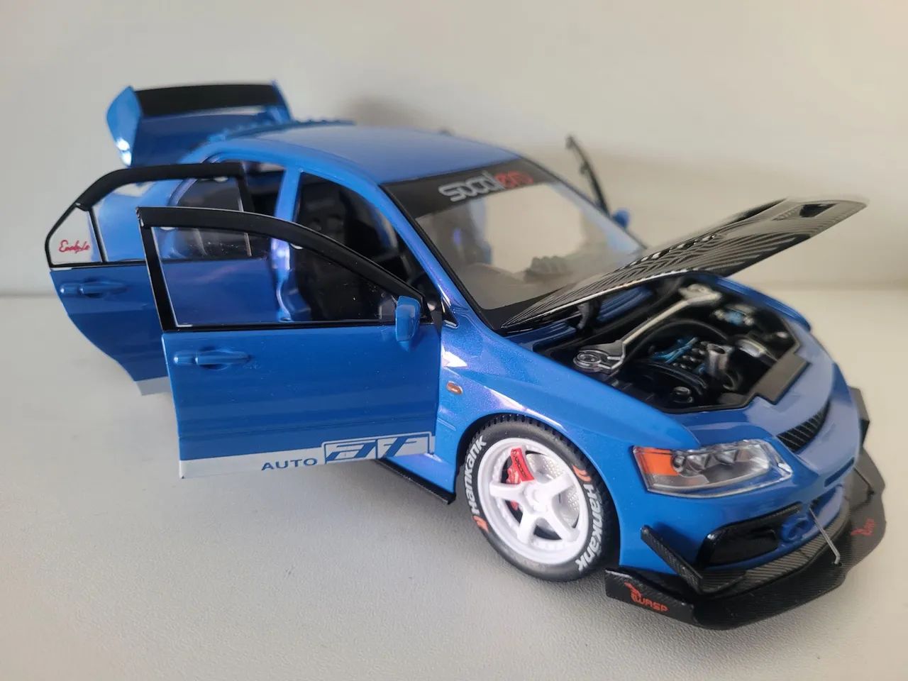 Miniatura Lancer Evolution 1/24, três cores - Foto 2