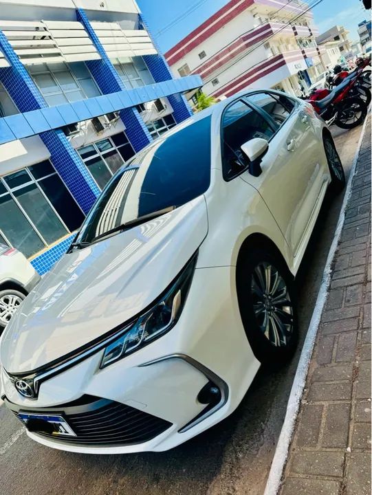 Vendo Toyota Corolla XEI 2.0 Branco Pérola Impecável, carro na garantia.