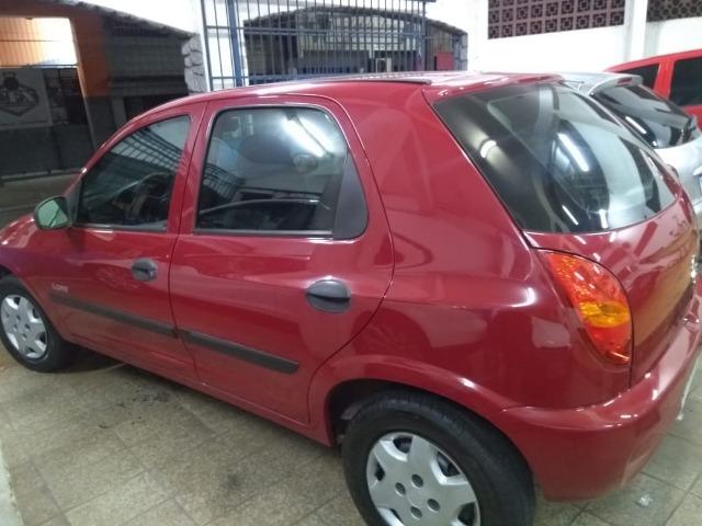 Celta Life 1.0 2006 vermelho 4 portas ar condicionado e travas elétricas - Foto 6