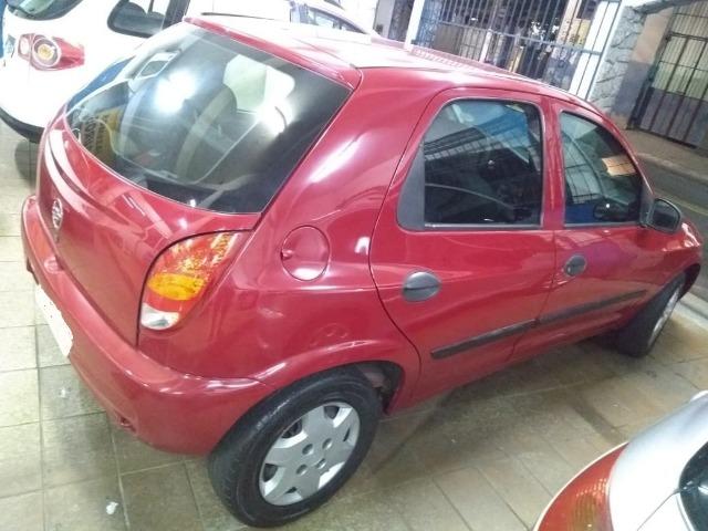 Celta Life 1.0 2006 vermelho 4 portas ar condicionado e travas elétricas - Foto 5