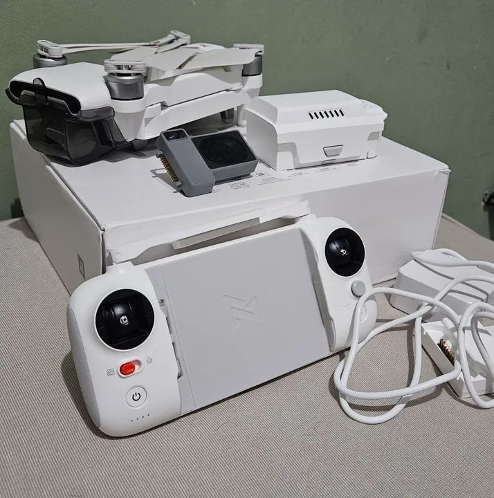 Fimi X8 Tele- Carrega objetos e reproduzir áudio.