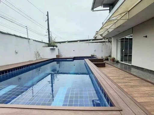 Sobrado com 4 dormitórios à venda, 131 m² por R$ 1.200.000,00 - Guaiuba - Guarujá/SP