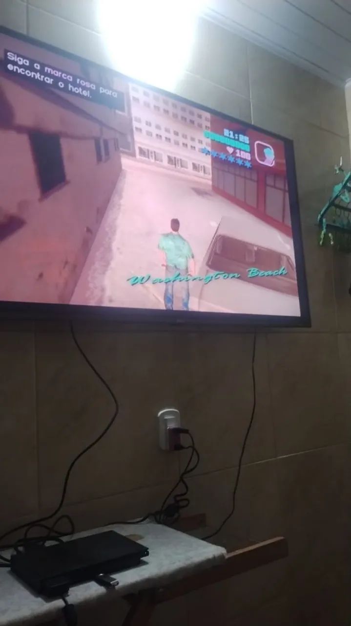 Vendo essa PS2 com várias tipo de jogo indo junto 