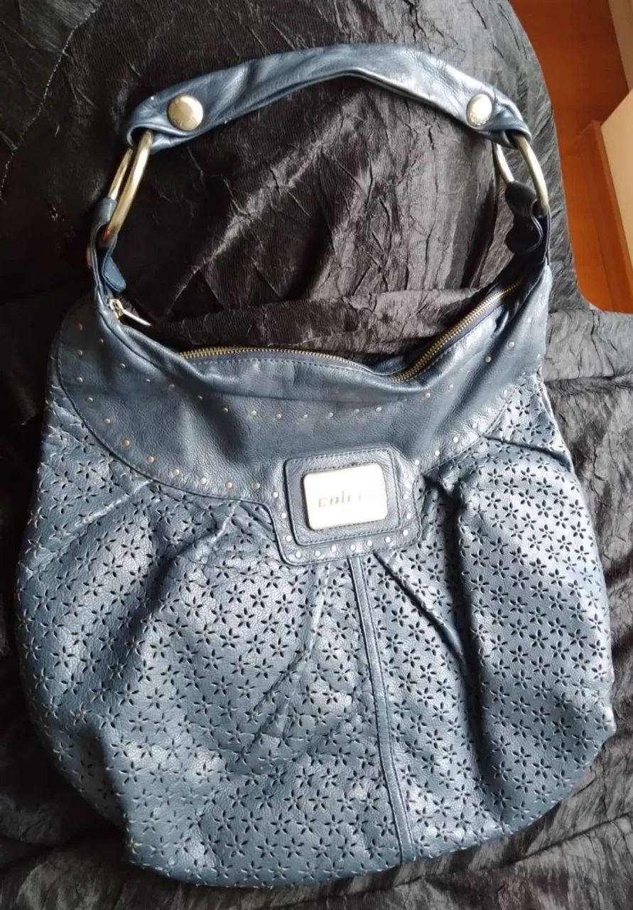 Vendo bolsa de couto legítimo.