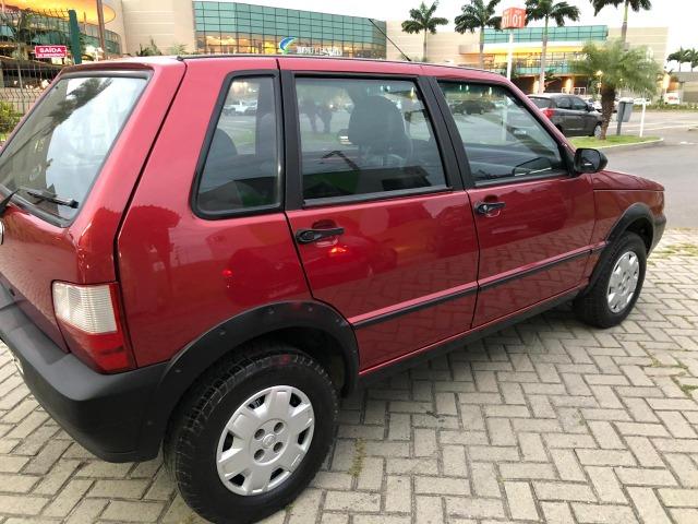 Fiat uno mille fire 4p completão com direção hidráulica pneus novos - Foto 5