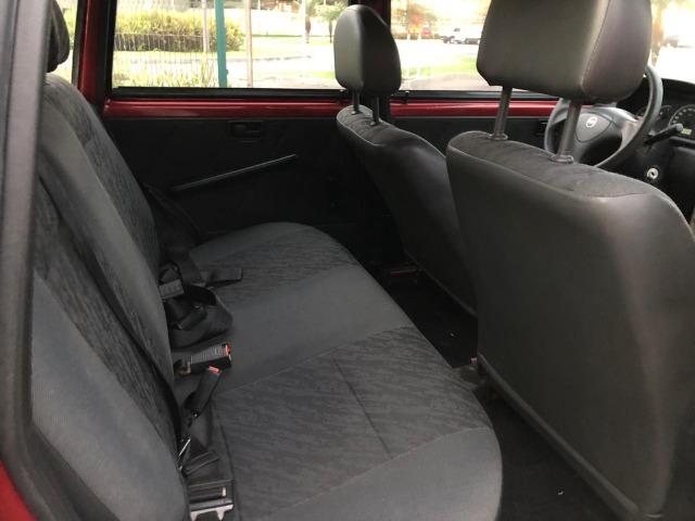 Fiat uno mille fire 4p completão com direção hidráulica pneus novos - Foto 8