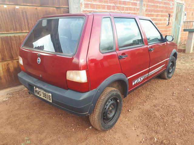 Troco Fiat Uno ou vendo - Foto 2