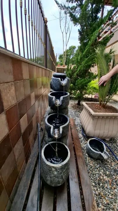 Fonte de água para jardim em pedra  