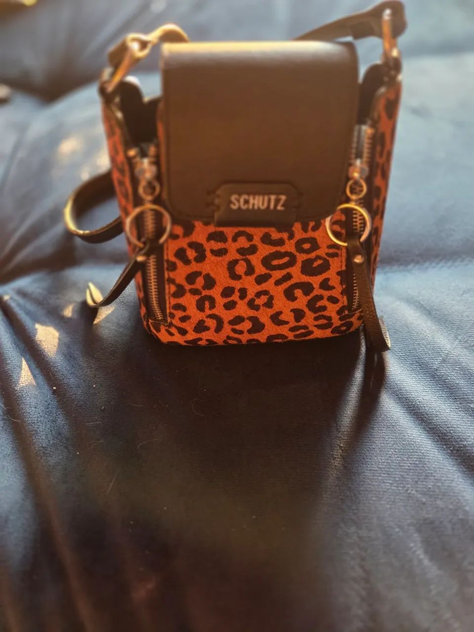 Bolsa transversal Schutz oncinha