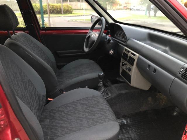 Fiat uno mille fire 4p completão com direção hidráulica pneus novos - Foto 7