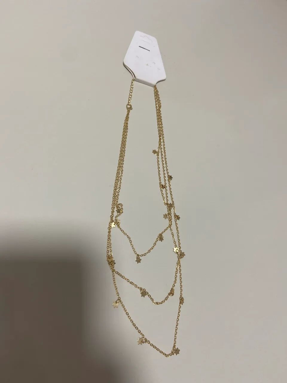 Colar dourado de estrela 