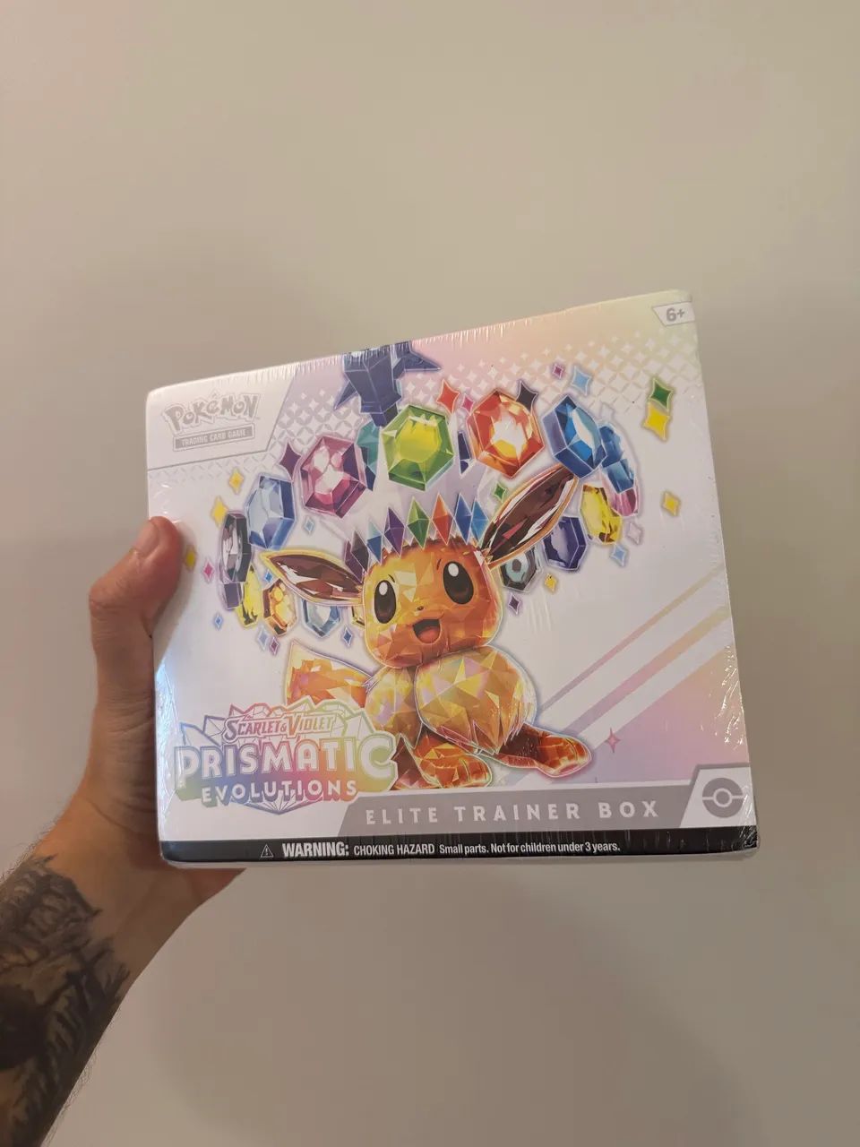 ETB evoluções Prismáticas inglês Lacrada - Hobbies e coleções