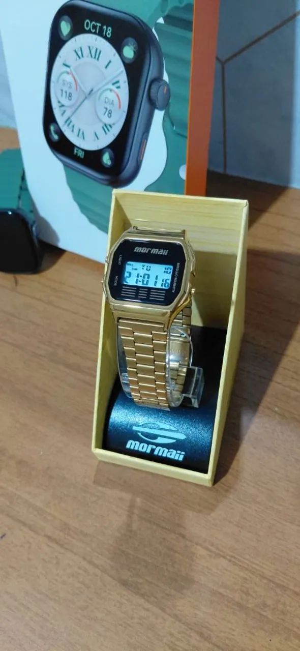 Relógio Mormaii dourado 