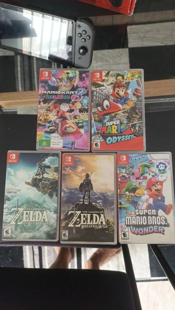 Nintendo switch V2 with 5 games with the box64315488029826121