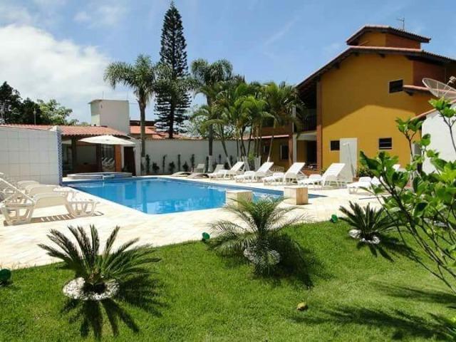 Casa na praia com piscina aquecida, 2 spar, salão de jogos, ar condicionado