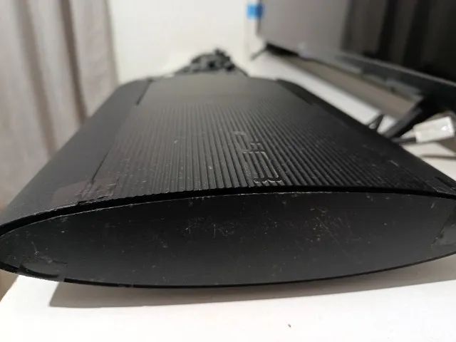 Ps3 com duas Manetes , e 60 jogos  - Foto 4