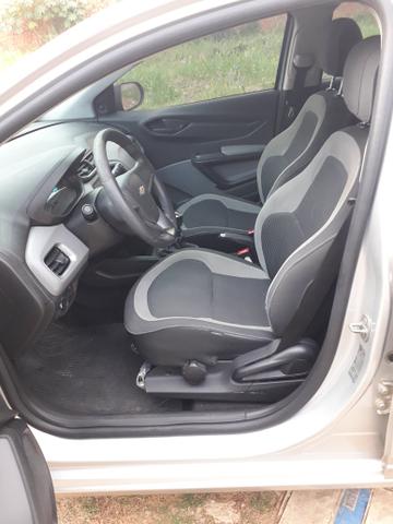 Ônix LT 1.0 2014 Flex prata, dir hidráulica, vidro e trava elétrica, som, ar, 77km - Foto 4
