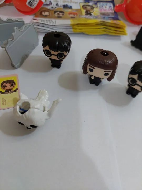 Três personagens Harry Potter