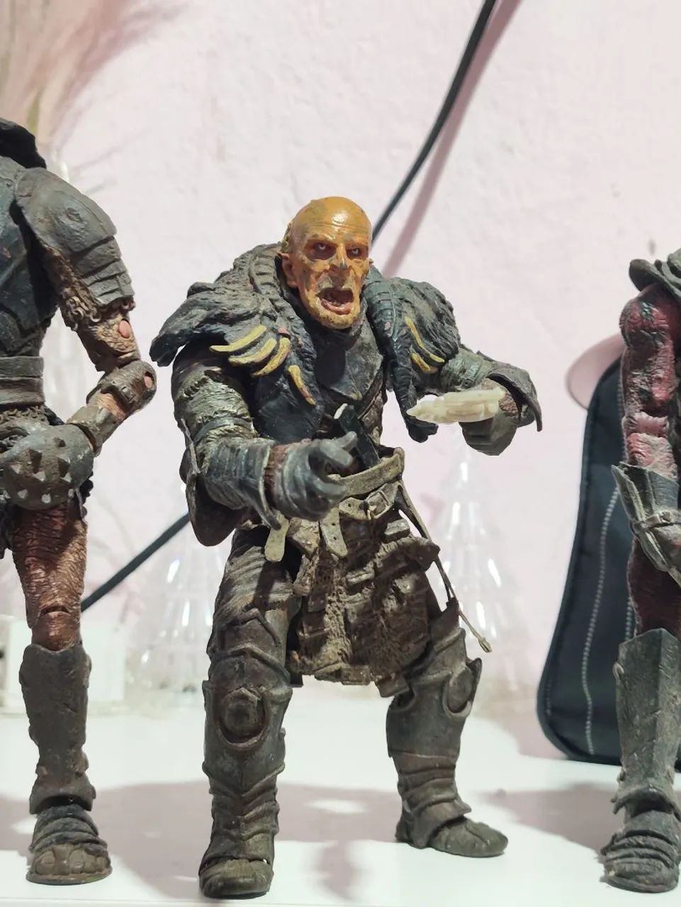 3 bonecos de orcs.