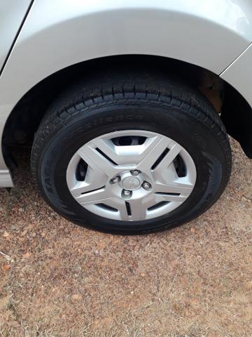 Ônix LT 1.0 2014 Flex prata, dir hidráulica, vidro e trava elétrica, som, ar, 77km - Foto 7