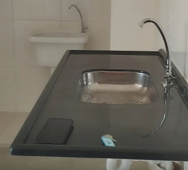 Kitchen countertop with stainless steel sink and synthetic marble, includes drain and faucet
