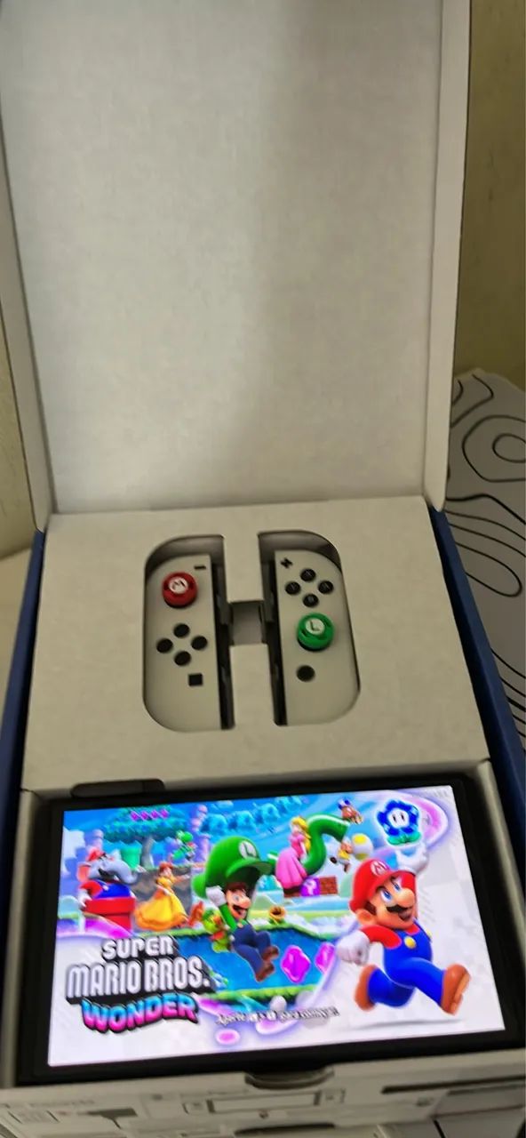 Nintendo Switch OLED - Completo + 2 Jogos - Foto 5