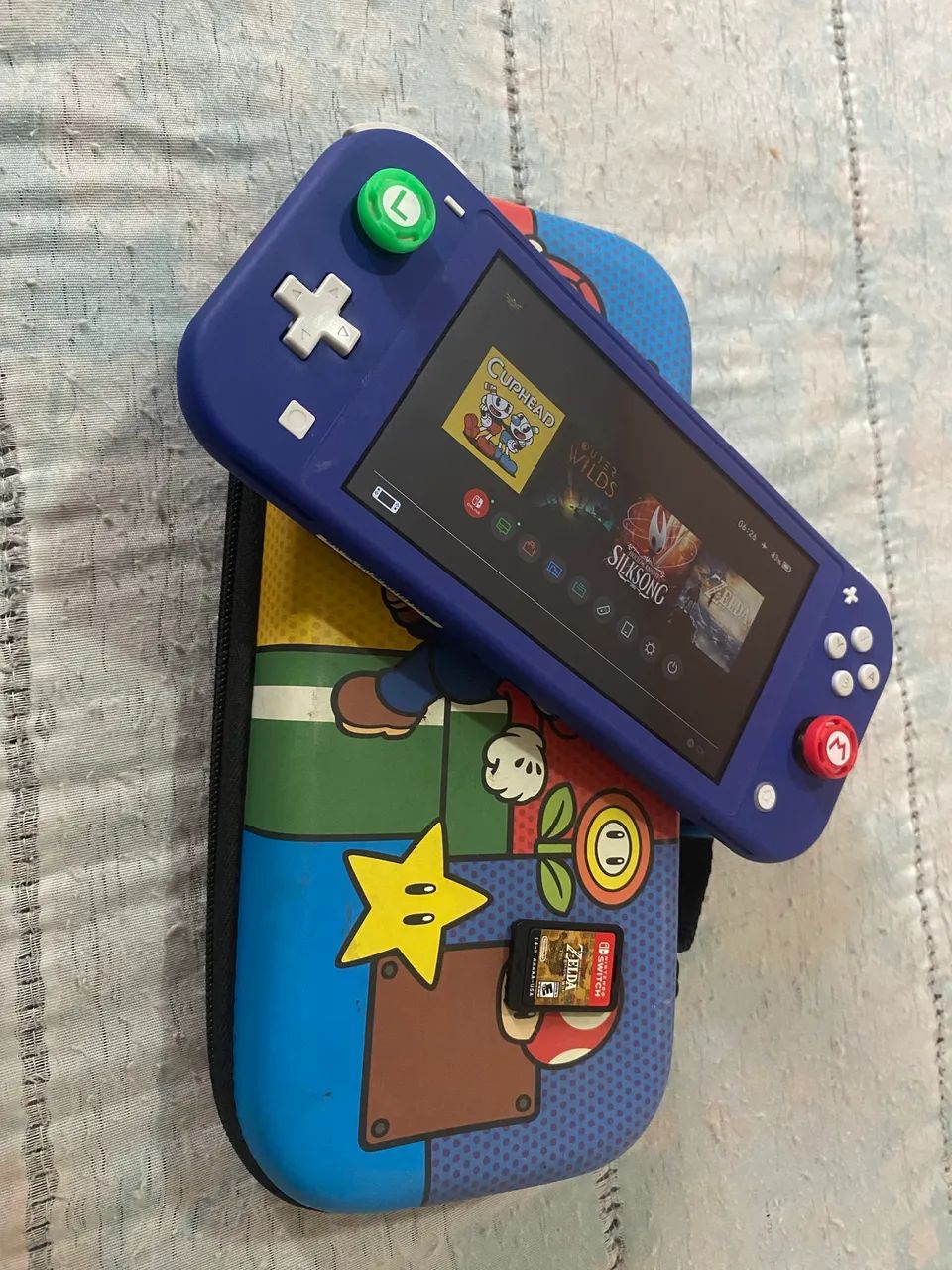 Nintendo switch lite + zelda BOTW(físico) + case - Jogos de Vídeo
