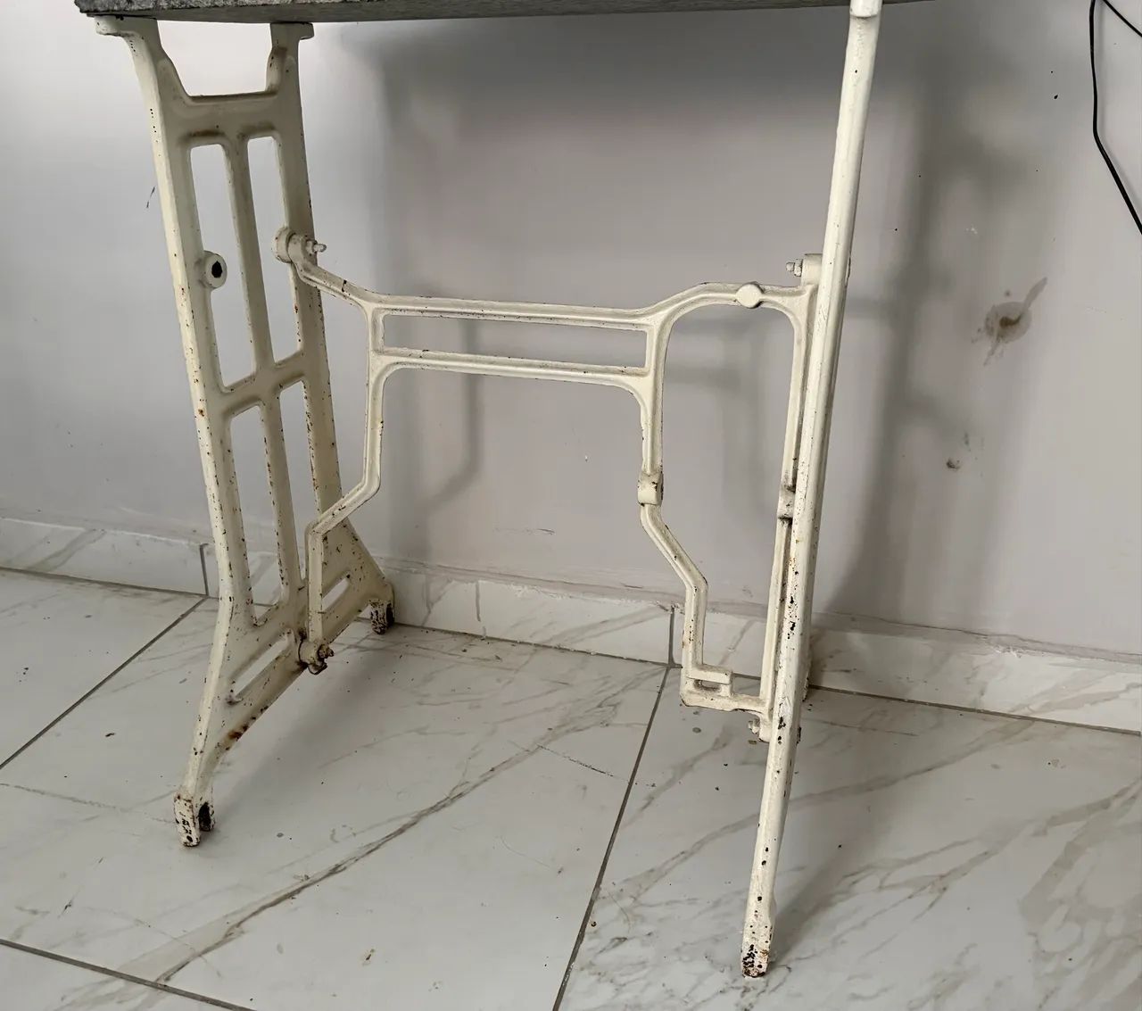Pé de máquina de ferro