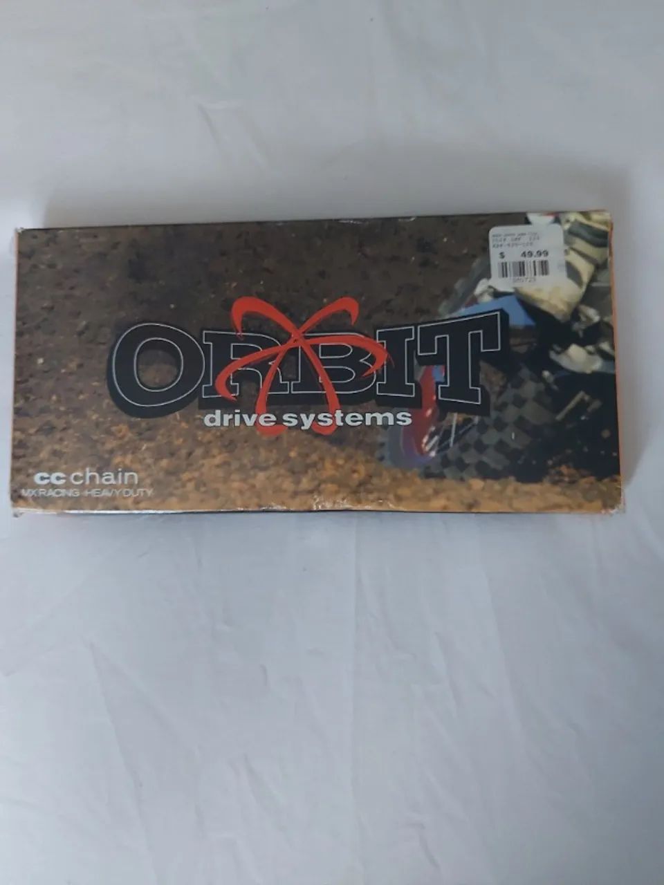 Corrente motocross ORBIT 520 120 elos s/oring  dourada. 