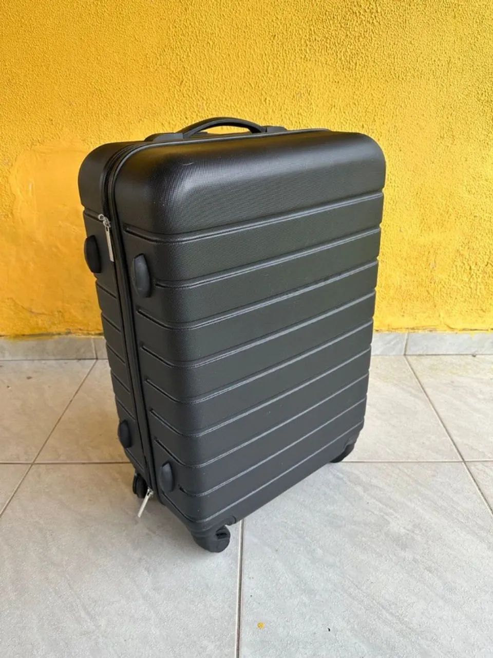 Medium-sized rolling suitcase with large wheels