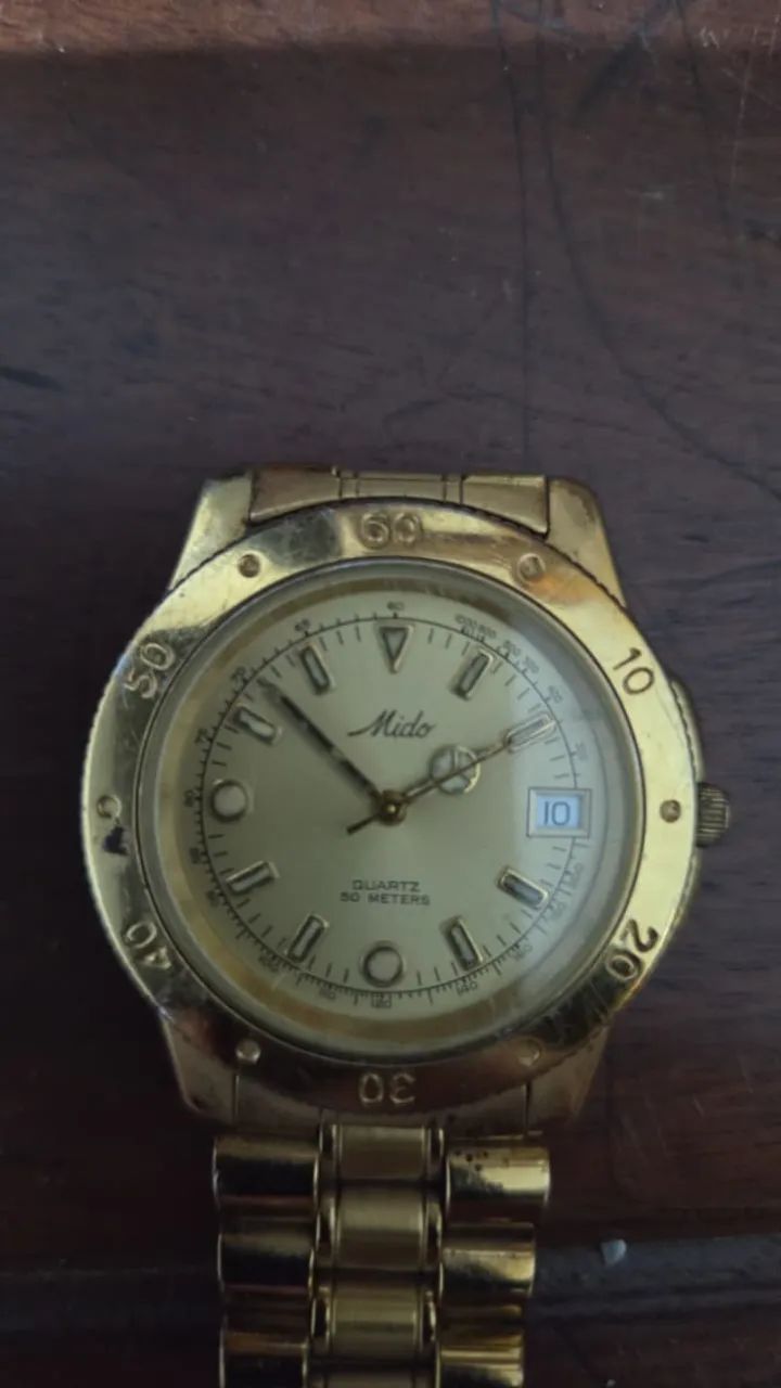 Relógio Mido quartz 50 meters dourado com pulseira original e numeração