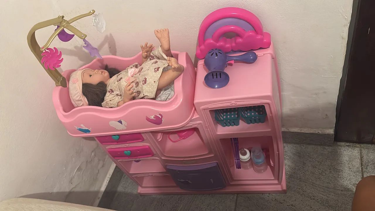 Brinquedo trocador com boneca 