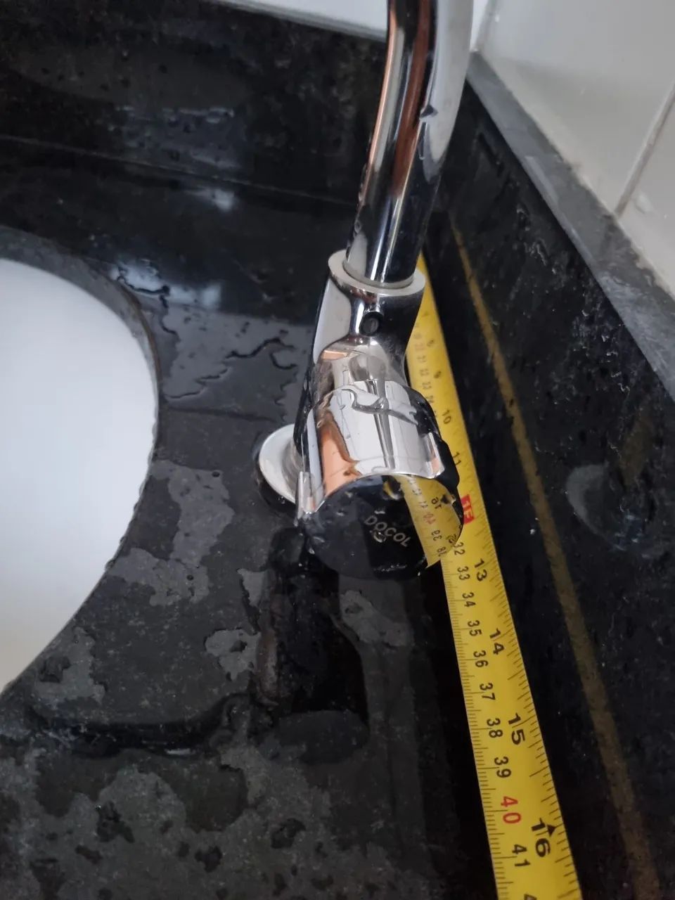 Granite countertop sink with porcelain basin, Docol faucet.64717753468547121