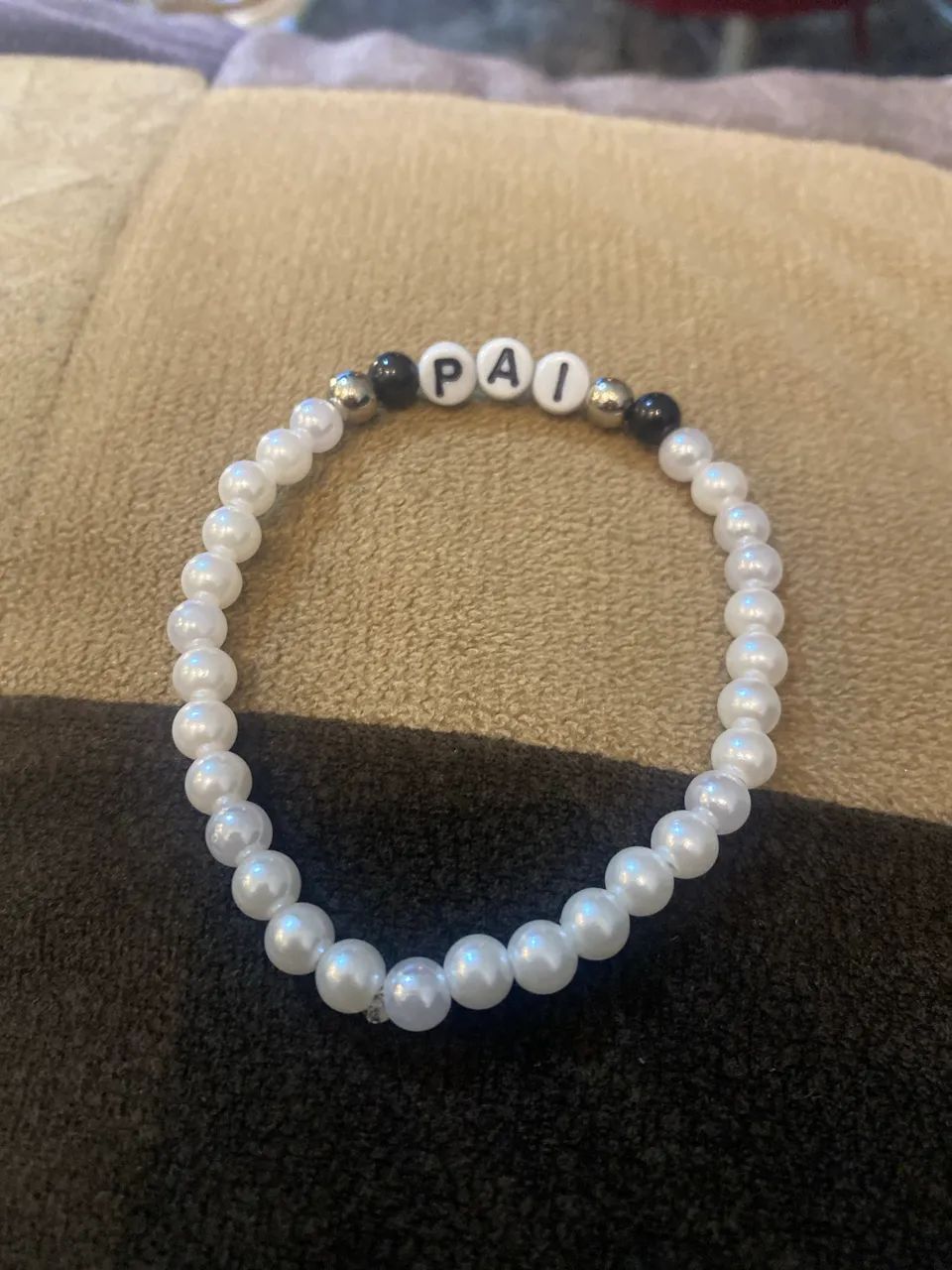 Pulseira de miçanga com o nome pai