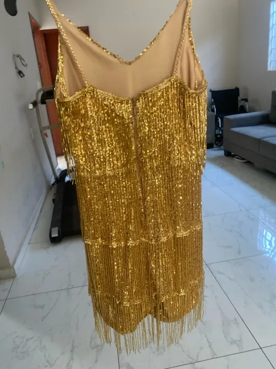 Macacão dourado com franja