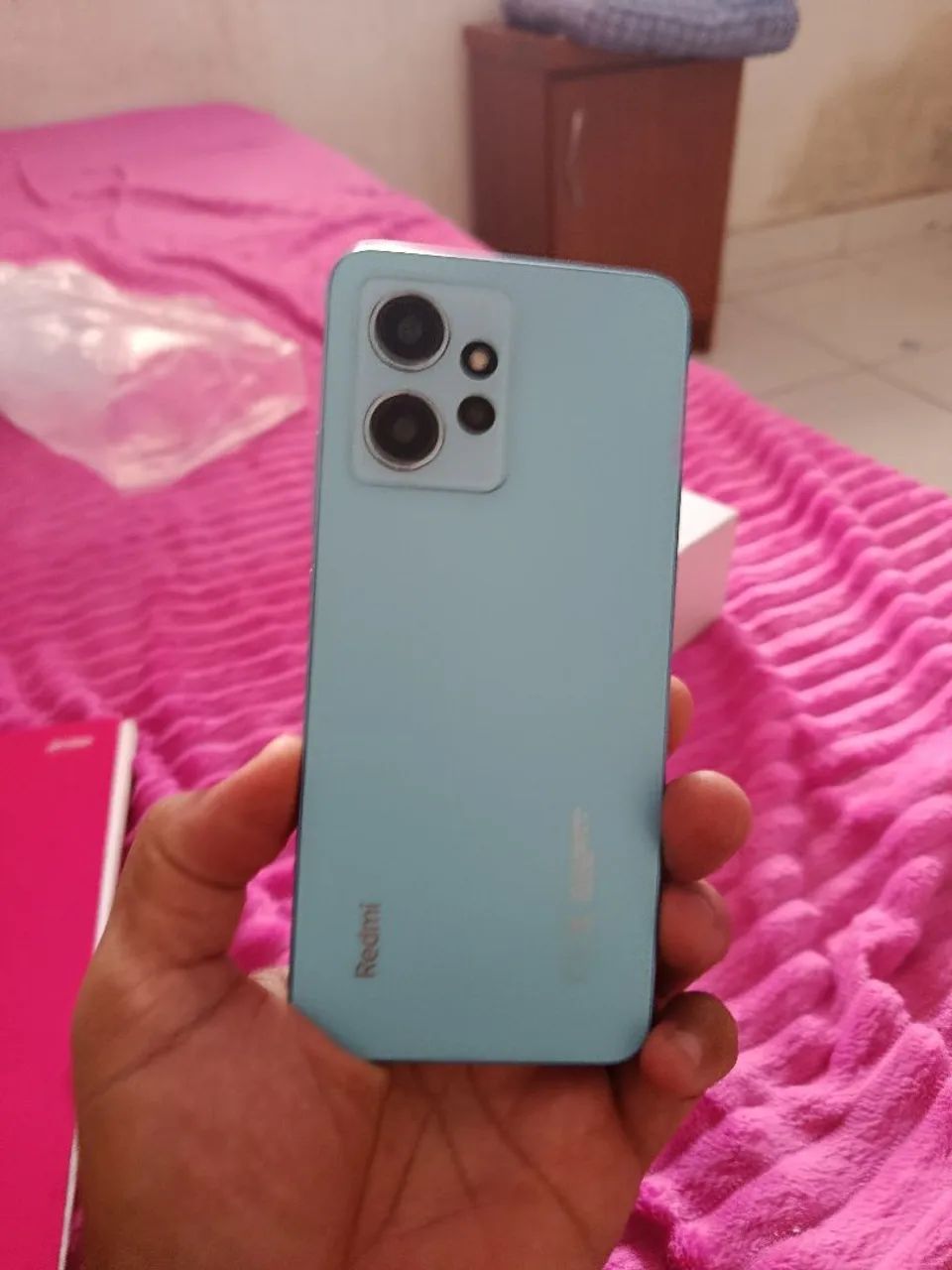 Celular redimi 12 bem novinho cem a arranhão