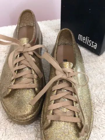 Tenis best sale dourado melissa