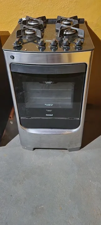 Fogão Consul 4 bocas cor Inox com mesa de vidro e grade de ferro fundido