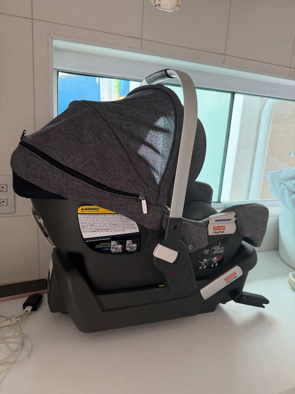 Bebê conforto Stokke com base isofix 