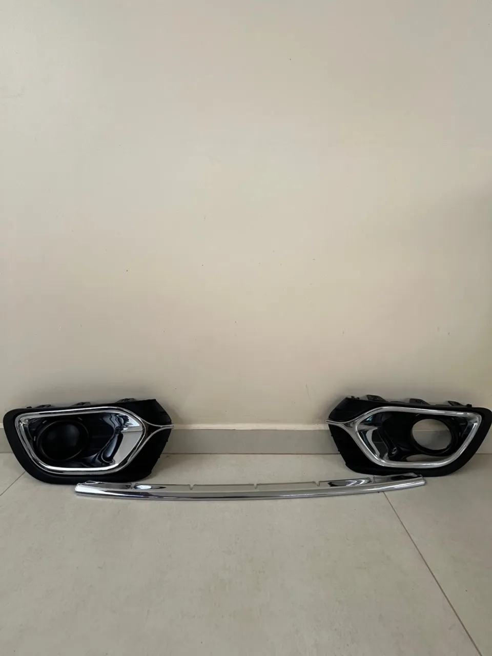 Moldura farol de milhas Logan 2014 a 2019.