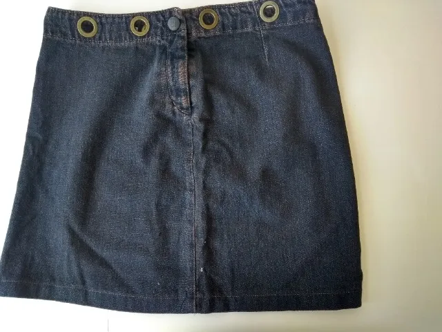 Saia Jeans com ilhós. Marca Lei Básica nº 38, 100% algodão. Fabricada no Brasil. Valor par