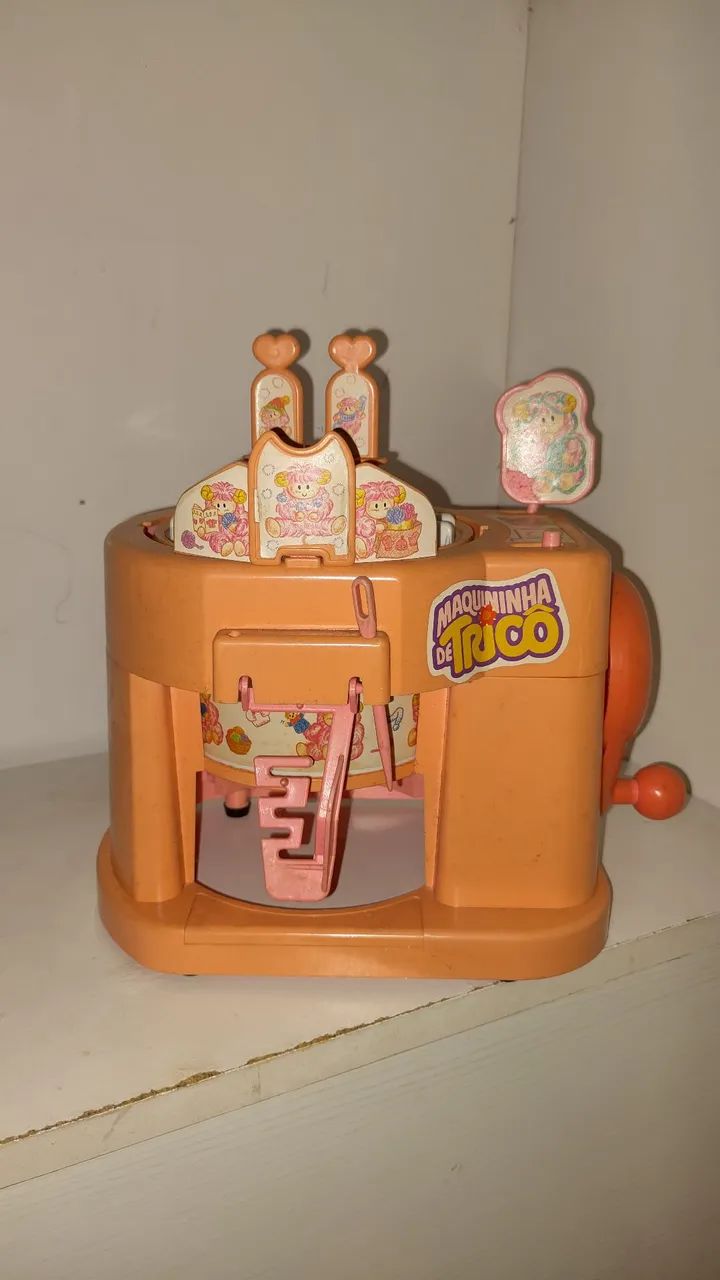Maquininha de tricô de brinquedo antiga