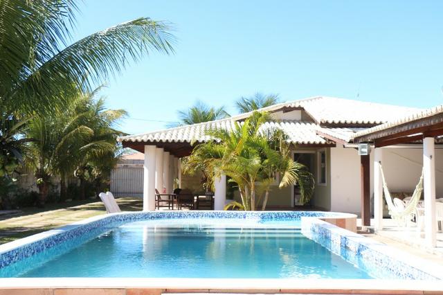 Novembro, feriado em casa de praia, com 5 quartos, piscina e churrasqueira